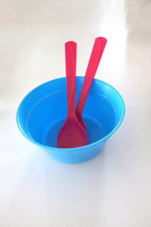 Colorful plastic bowl and Cutlery  for a child , Concept  kidsの写真素材