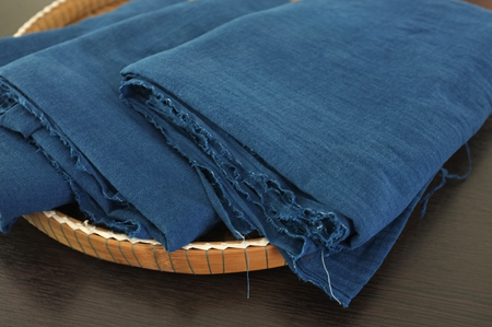 Thai traditional natural color and blue indigo dye cotton in Wicker trayの写真素材