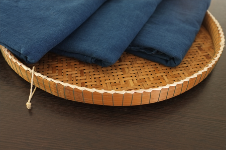Thai traditional natural color and blue indigo dye cotton in Wicker trayの写真素材