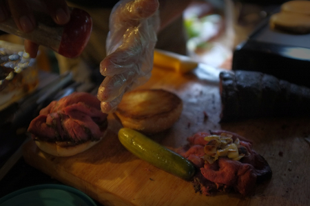 Thai junk food Low key image ,Raw beef burgers, buns with sesame seeds, tomatoes, pickle and spices for cooking a hamburgerの写真素材