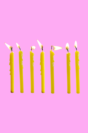 Orange candle or orange paraffin or wax burning party candle for retouch. Concept Happy new year , happy birthday , scaryの写真素材