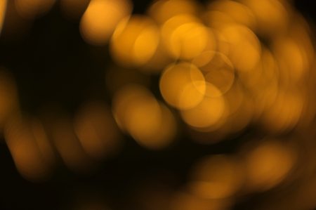 Golden bokeh abstract light,Orange background , Concept love , summerの写真素材