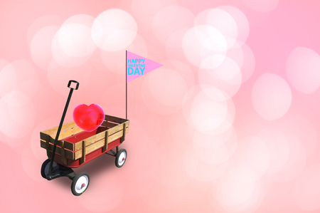 Heart in little red wood wagon with free space for text input, logo, etc. Concept Valentine DAY , I love you .の写真素材