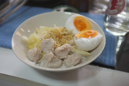 Kanom Cheen Saw Nam or Thai rice noodle with coconut milk with boil eggの写真素材