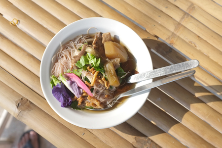 Rice noodle soup with mushroom .の写真素材