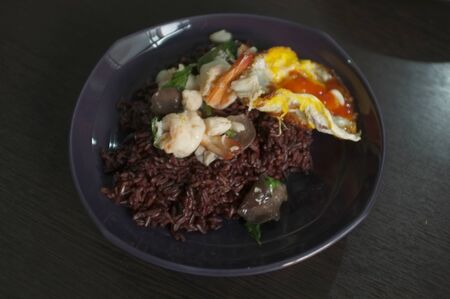 Thai food , Stir fried Thai basil with Prawns and a fried eggの写真素材