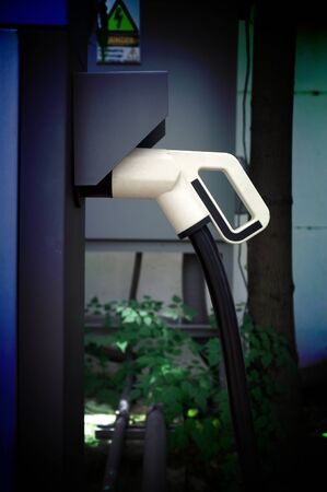 Electric vehicle charging (Ev) station with plug of power cable supply for Ev carの写真素材