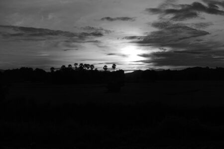 A colorful sunup above a small train station in thailand の写真素材