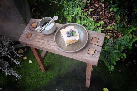 Coffee with piece of cake on wooden table , Concept Relax time, Copy space. Place for text.の写真素材
