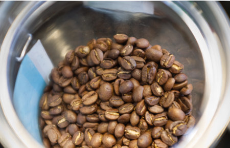 Roasted coffee beans background .