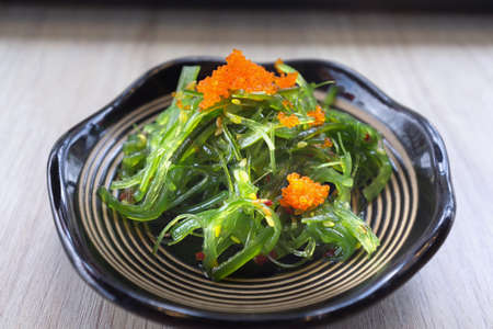Delicious fresh seaweed salad in dishの写真素材