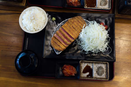 Fried crispy beef Gyukatsu steak served with riceの写真素材