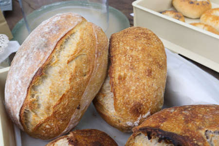 Bread close-up. Freshly baked sourdough bread with a golden crust  . Concept bakery , texture...