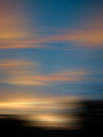 Blur Golden orange sky on top with the evening sunset glow.space for textの写真素材
