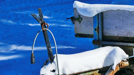 Trailer in the snow at the edge of the forestの写真素材