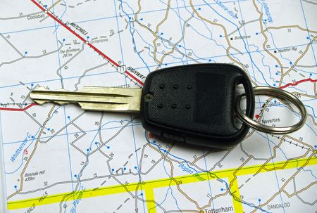 Car key on a map background