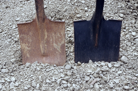 two shovels and gravelの写真素材