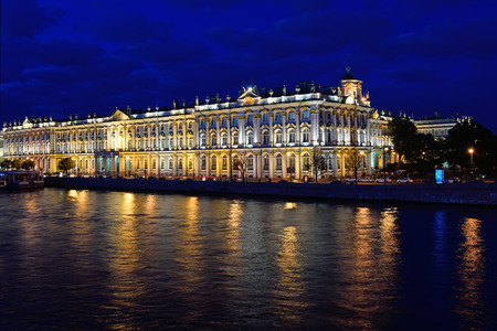 View of the Winter Palace from the Palace bridge on Neva river during the white nights in St. Petersburg. In the river reflected the lights of street lighting and lighting of the building.のeditorial素材