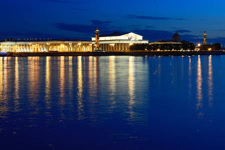Panoramic view of the spit of Vasilievsky island, Rostral columns and the Naval Museum with the reflection of lights in the river Neva late during the white nights in St. Petersburgのeditorial素材