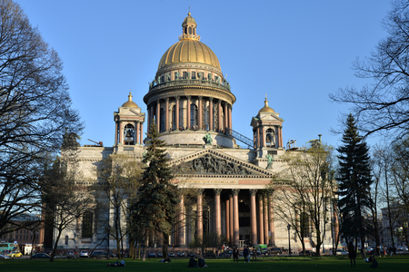 St. Isaac's Cathedral and walking people on a Sunny day in St. Petersburgの写真素材