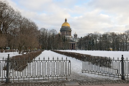 View of St. Isaac's Cathedral and the fence of Alexander garden with Admiralty embankment in winter in St. Petersburgの写真素材