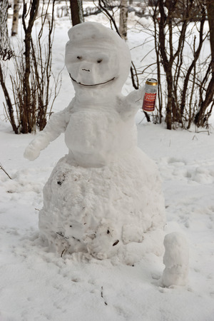 The snowman in the yard in St. Petersburg in the winter 2016-02-23の写真素材