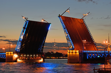 Views of the TV tower in the target separated Palace bridge on Neva river in Saint Petersburg during the white nights. The reflection of street lamps and illumination in the water..の写真素材