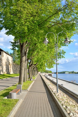 A streetlight and alley on the embankment of the Velikaya river in Pskovの写真素材