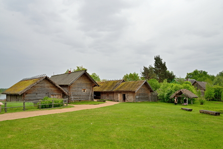 Old Russian log hut in Pushkin Mikhailovskoe summer cloudy dayの写真素材