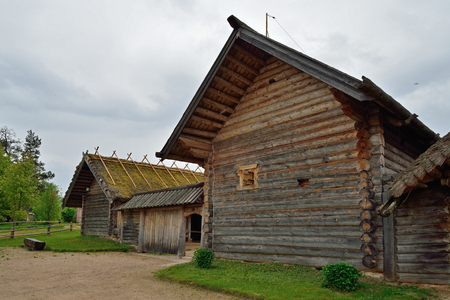Old Russian log hut in Pushkin Mikhailovskoe summer cloudy dayの写真素材