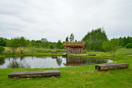 Vintage wooden log sauna by the pond in the Museum of Pushkin Mikhailovskoe villageの写真素材