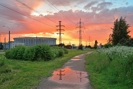 CCM St. Petersburg , the former V. I. Lenin and high-voltage power line reflected in the water at sunsetの写真素材