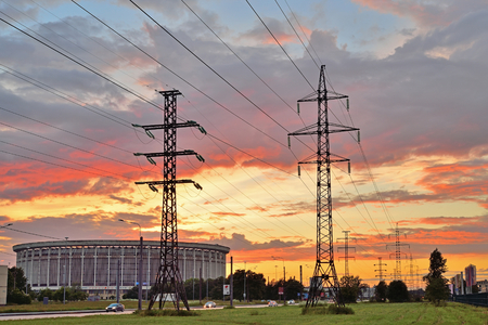 St.PETERSBURG, RUSSIA - 2017 JUNE 18, Sports and Concert complex St. Petersburg and supports high voltage power lines at sunsetの写真素材