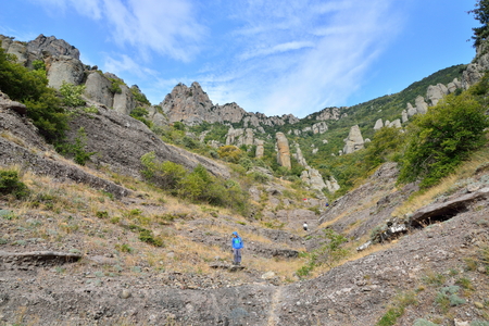 The boy goes through a mountain gorge in the valley of ghosts. Crimeaの写真素材