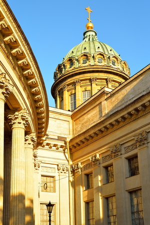 The dome and colonnade of the Kazan Cathedral in the sunlight on a summer sky backgroundの写真素材