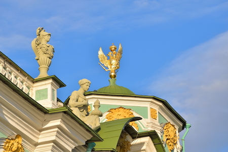 Golden sculpture of a majestic eagle of Russia on the roof of the Winter Palace in Saint-Petersburg.の写真素材