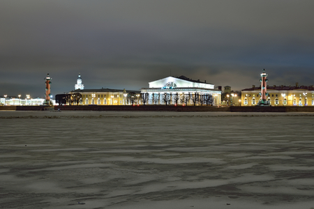 The view on the Strelka of Vasilyevsky island from the Peter and Paul fortress winter night in Saint Petersburgの写真素材