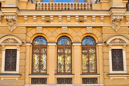 Wrought iron bars on the Windows of the old house on the Griboyedov canal embankmentの写真素材