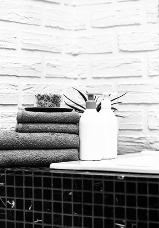 Towels with Liquid Soap on Table in Bathroom. Mockup for Bathing Products in the Bathroom. Spa Shampoo, Shower Gel, Liquid Soap. Beauty Care Accessories for Bath.の写真素材