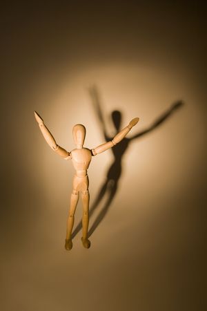 A wooden mannequin invoking higher powers
