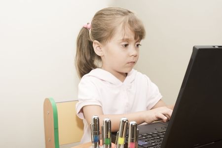 Portrait of beautiful caucasian gir leaning with computer