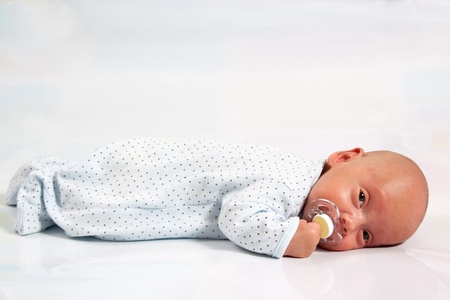 Portrait of Adorable Baby Boy Suckingの写真素材