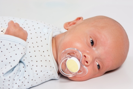 Portrait of Adorable Baby Boy Suckingの写真素材