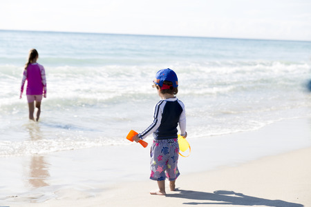Portrait Of Happy Boy And His Sister On The Beachの写真素材