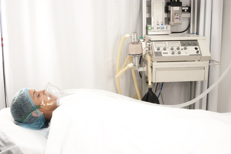 Beautiful patient receives anaesthetic in hospitalの写真素材