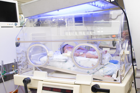 Newborn baby inside incubatorの写真素材