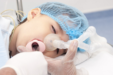 Portrait of child patient Receiving artificial ventilation in hospitalの写真素材