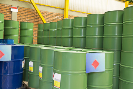 Green barrels or chemical drums stacked up