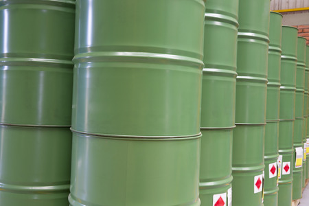 Green barrels or chemical drums stacked up