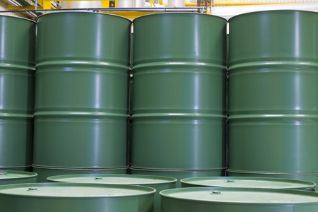 Green barrels or chemical drums stacked up